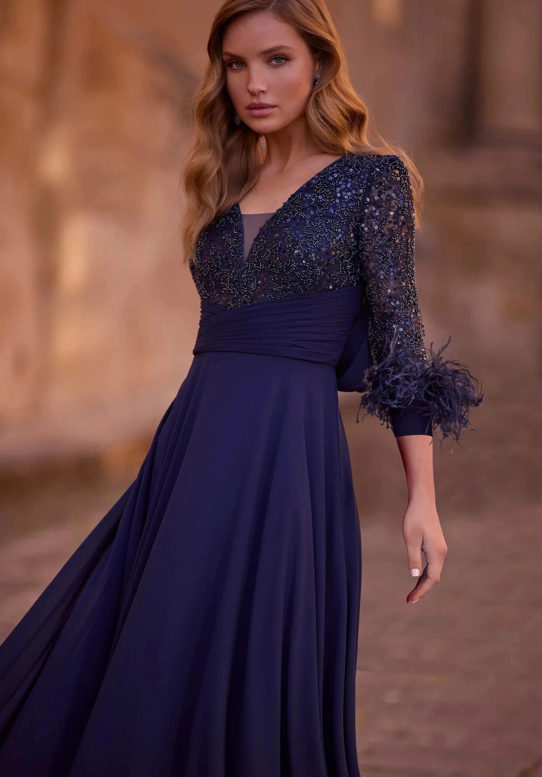 Elegant Chiffon and Mesh Dress with Puff Sleeves and Feather and Beaded Details
