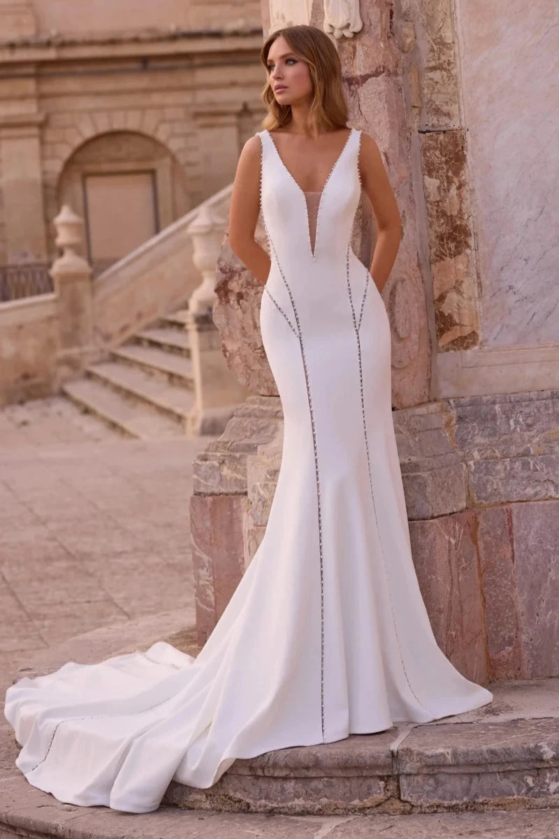 A Mermaid Wedding Dress in Crepe with Jeweled Bodice